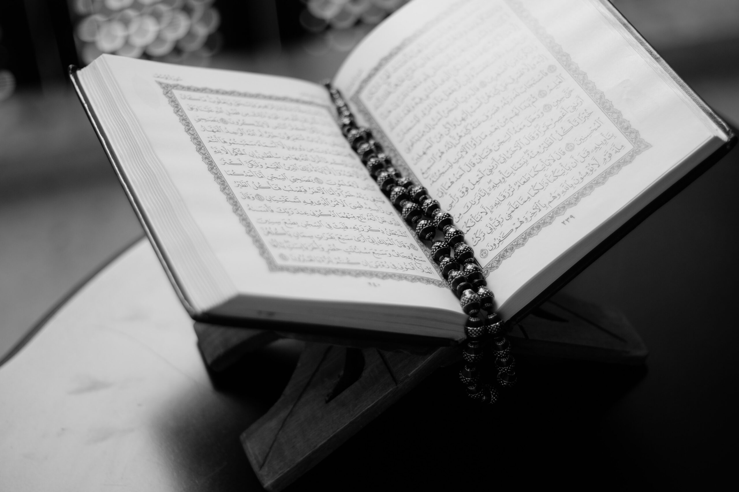 Photo by Abdulmeilk Aldawsari: https://www.pexels.com/photo/monochrome-photo-of-opened-quran-36704/